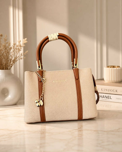 Sac à main Alexander avec breloque cerise dorée