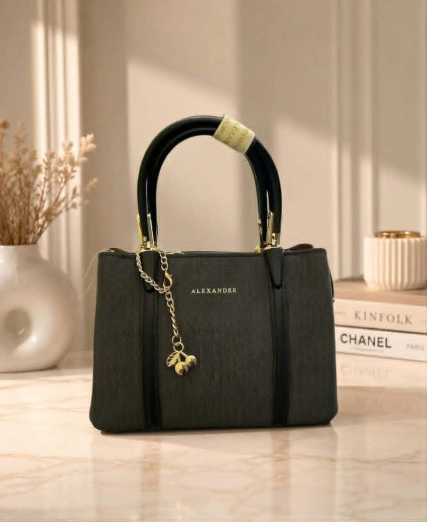 Sac à main Alexander avec breloque cerise dorée