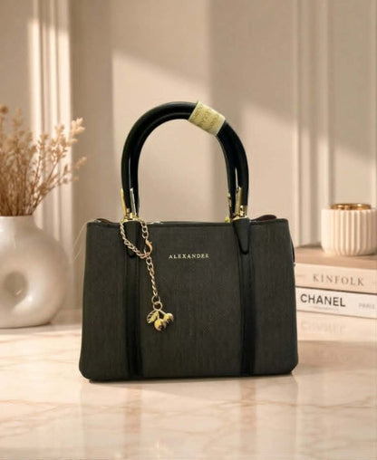 Sac à main Alexander avec breloque cerise dorée